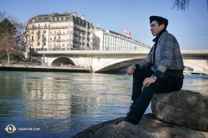 Principal Dancer Rocky Liao looks over the Geneva Rhone River. (Photo by Songtao Feng)